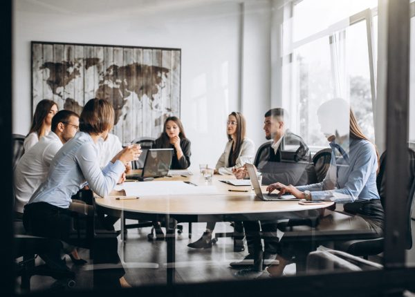 Group of people working out business plan in an office